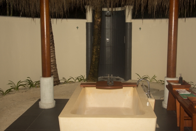 Outdoor bathtub and shower at Anantara Dhigu beach villa